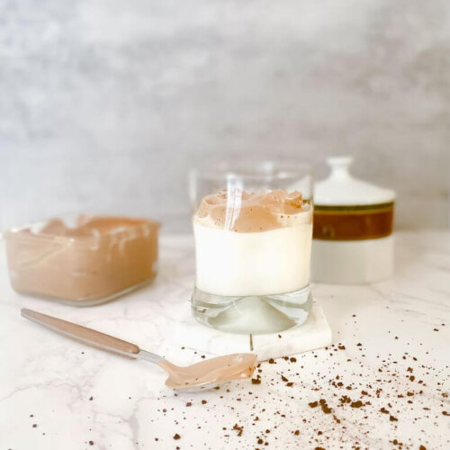 whipped coffee next to a spoon